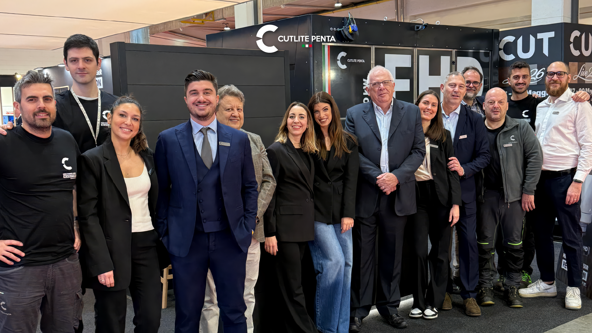 The Cutlite Penta Italy team at the SamuExpo stand in Pordenone in front of the FHD with the CUTLIVE26 graphics