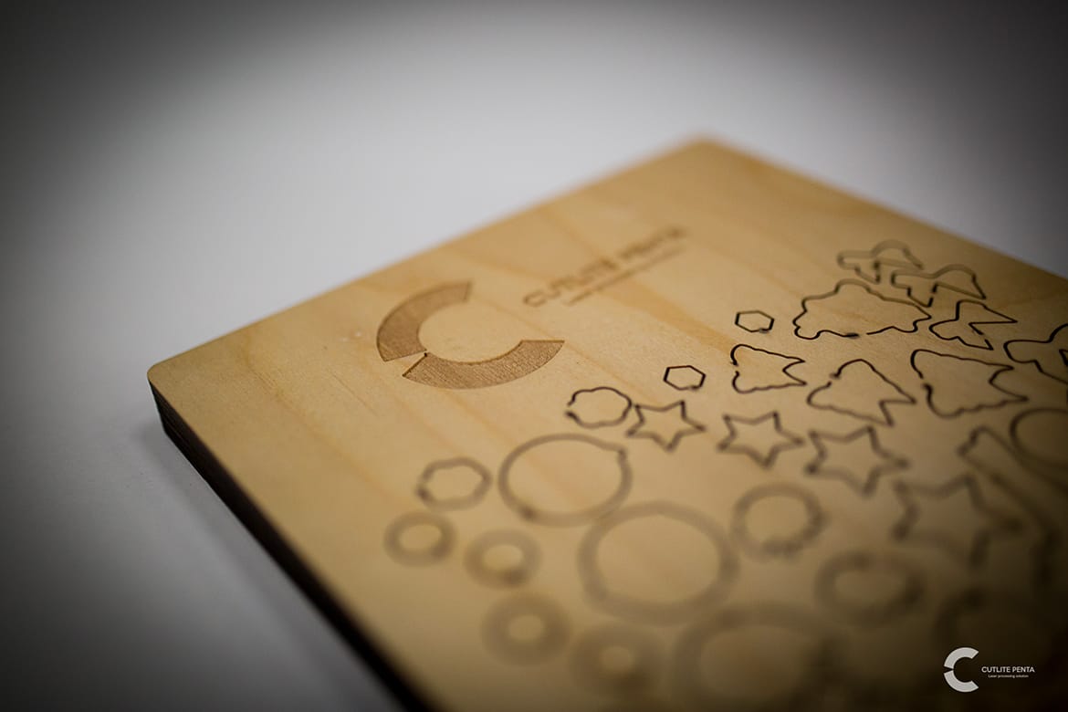 Wooden die with laser-cut shapes and the Cutlite Penta logo