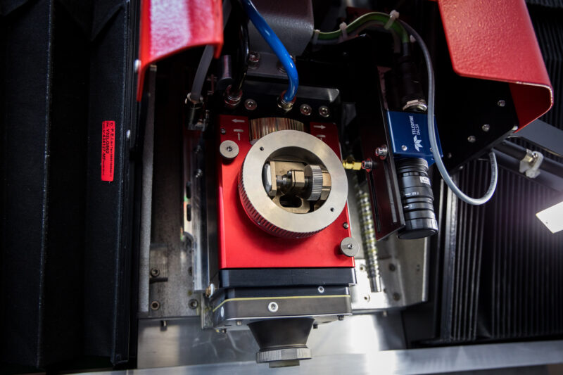 Cutlite Penta laser head cutting a plastic material